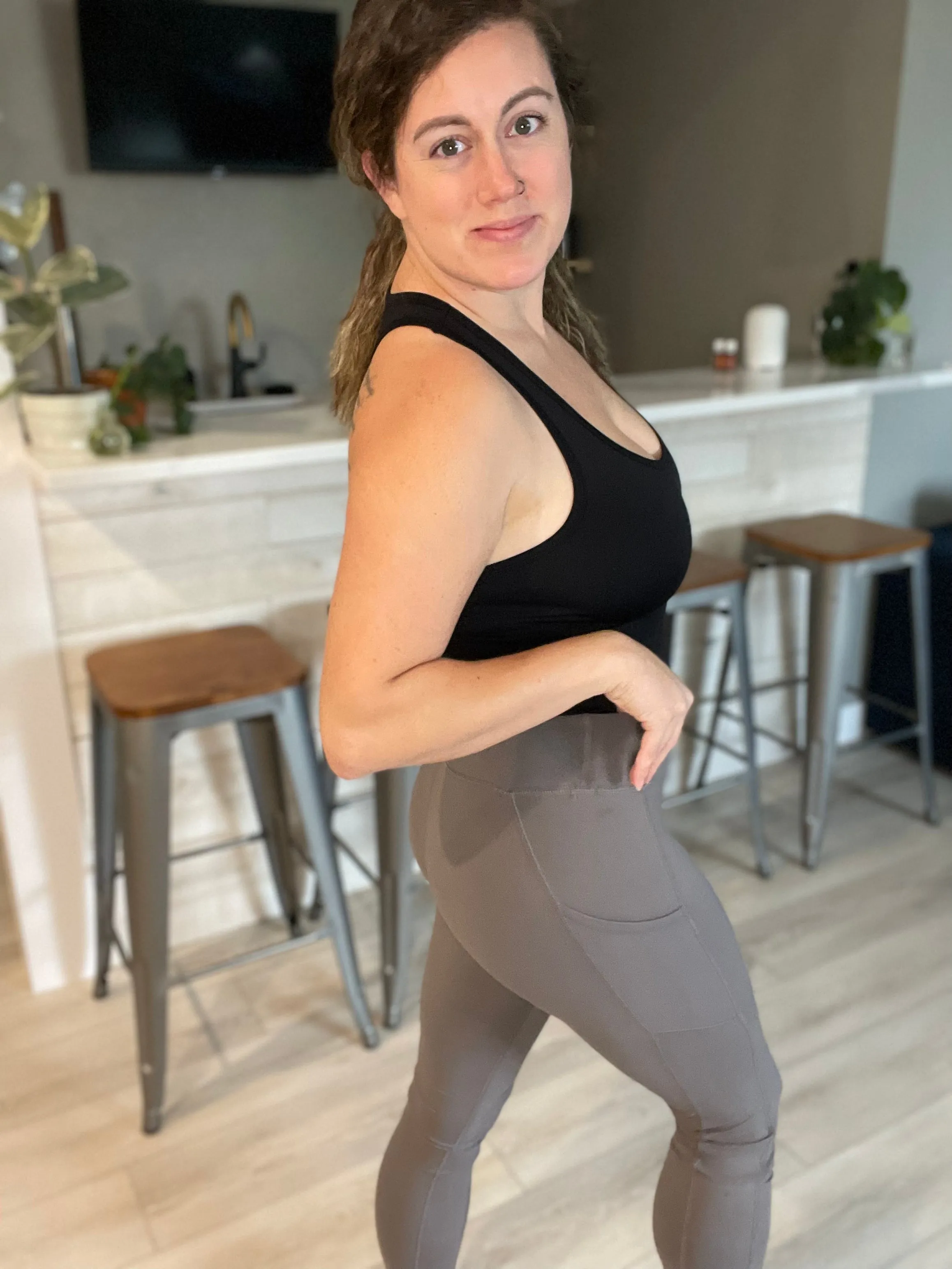 In a Smokey room, grey leggings